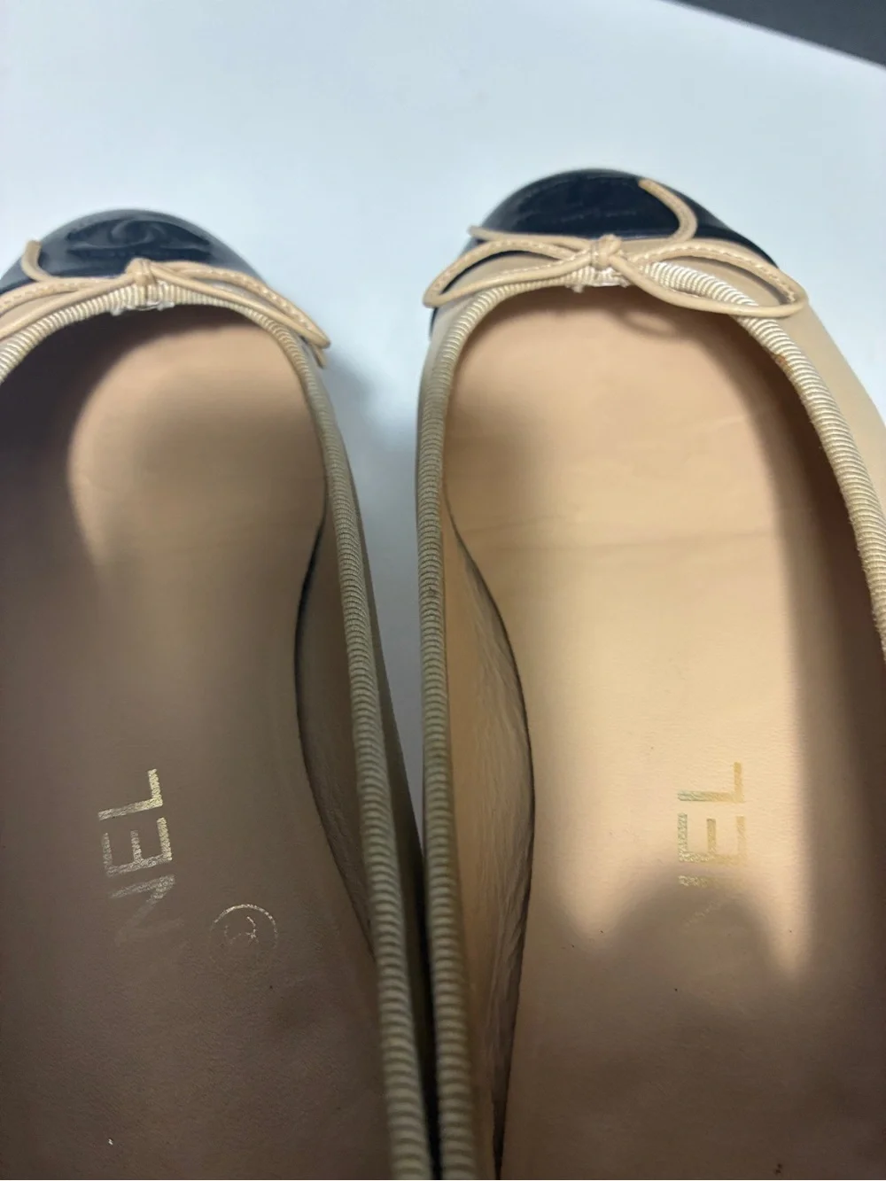 CHANEL Beige Leather Ballet Flats with Black Cap Toe